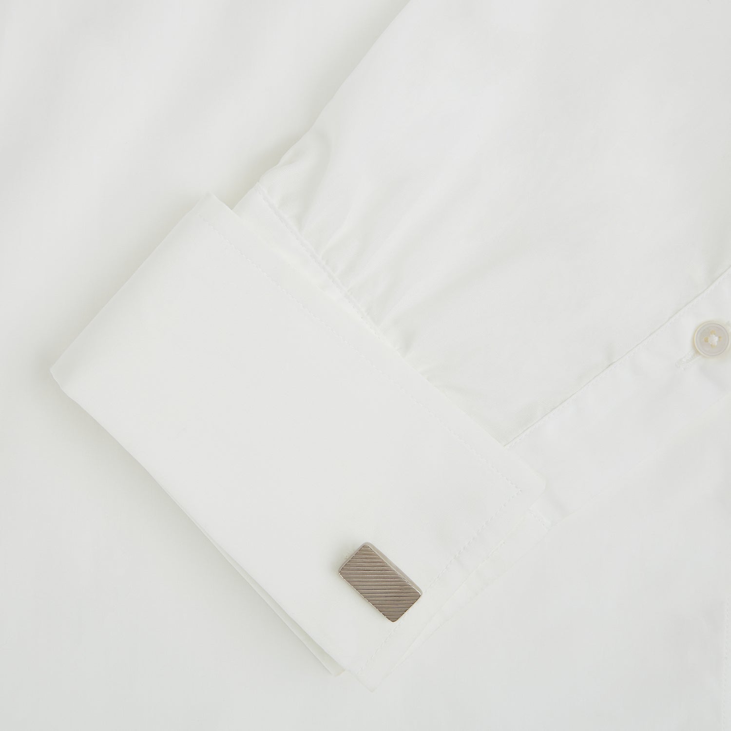 View 3 of product Turnbull & Asser's Silver Diagonal Striped Rectangular Cufflinks feature a sleek sterling silver design with diagonal stripes, displayed against a plain white background.