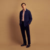 View 2 of product The Turnbull & Asser Navy Cashmere Duncan Knitted Shirt, a button-up with collar, long sleeves, chest pocket, and straight hem, is shown laid flat on a white background.