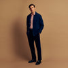 View 7 of product The Turnbull & Asser Red Check Cotton Weekend Fit Finch Shirt is a men's long-sleeved, button-up shirt with a Derby collar and red-and-white plaid pattern, displayed flat on a white background.