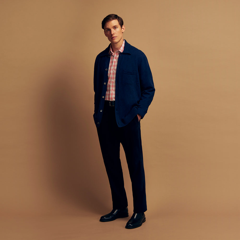 The Turnbull & Asser Red Check Cotton Weekend Fit Finch Shirt is a men's long-sleeved, button-up shirt with a Derby collar and red-and-white plaid pattern, displayed flat on a white background.