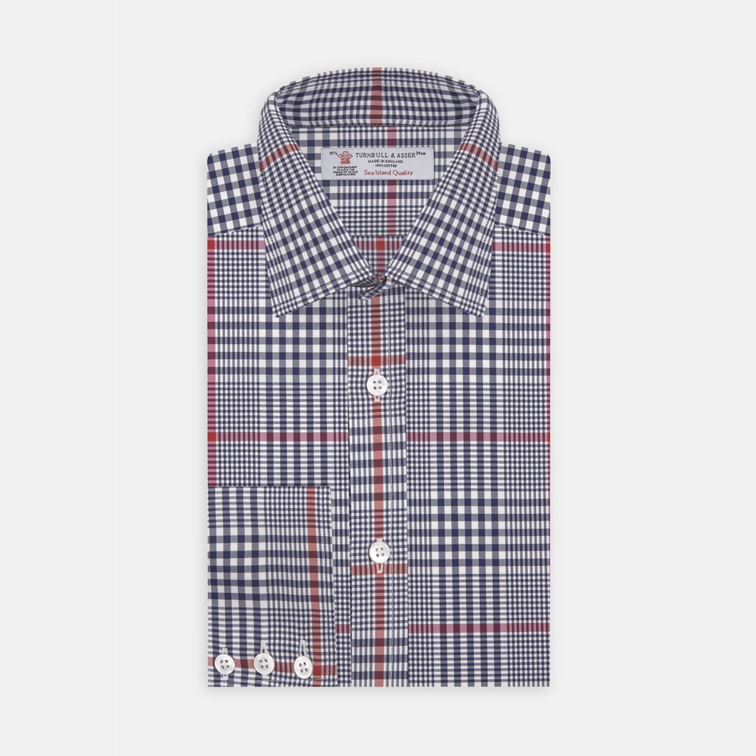 View 2 of product A circular swatch of Turnbull & Asser’s Navy and Red Prince of Wales Wide Check Cotton Fabric displays navy, white, and red intersecting stripes in a traditional check pattern, outlined by a gray border.