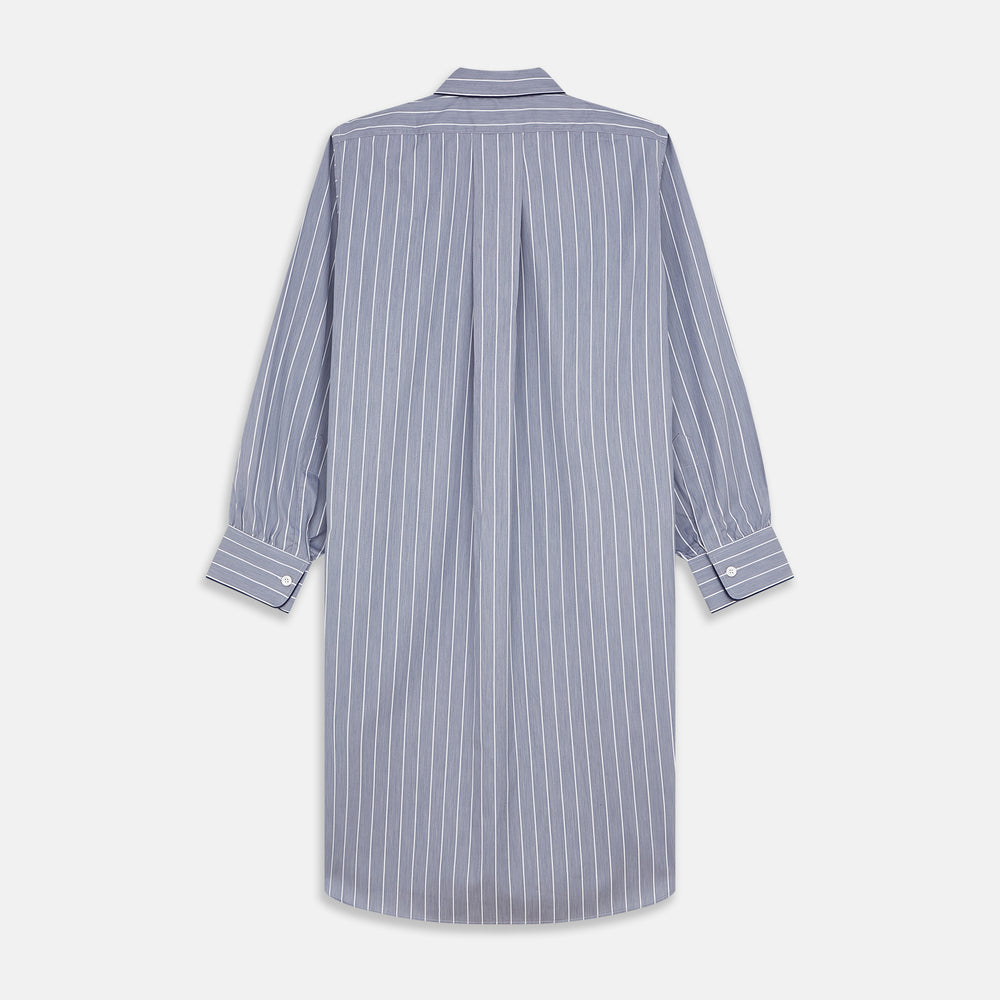 The Turnbull & Asser Pale Blue and White Pinstripe Cotton Blend Sussex Nightshirt pairs classic style with comfort, featuring long sleeves, a collar, front buttons, chest pocket, and curved hemline—perfect for luxury sleepwear.