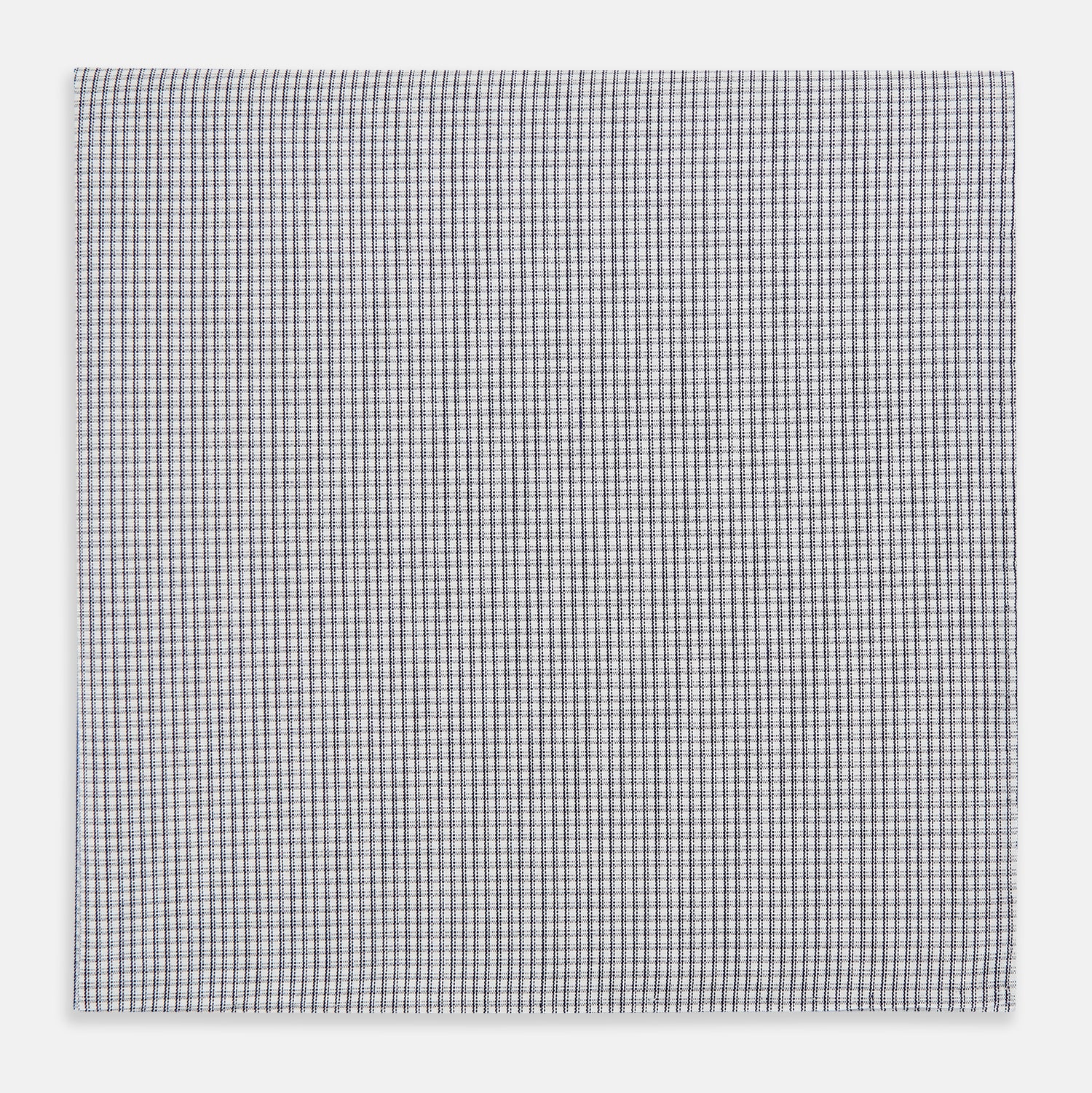 View 1 of product The Turnbull & Asser Navy Blue Shadow Grid Check Hand-Rolled Handkerchief showcases a small, evenly spaced blue and white check pattern and hand-rolled edges, neatly displayed against a white background.