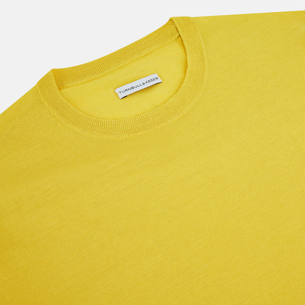 The Turnbull & Asser Canary Yellow Merino Round Neck Jumper features long sleeves and a crew neckline, shown here against a white background.