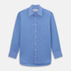 The Turnbull & Asser "The World Is Not Enough" blue cotton Istanbul shirt, as seen on James Bond, is a light blue oxford long-sleeve button-up with a pointed collar and white buttons, displayed on a white background.