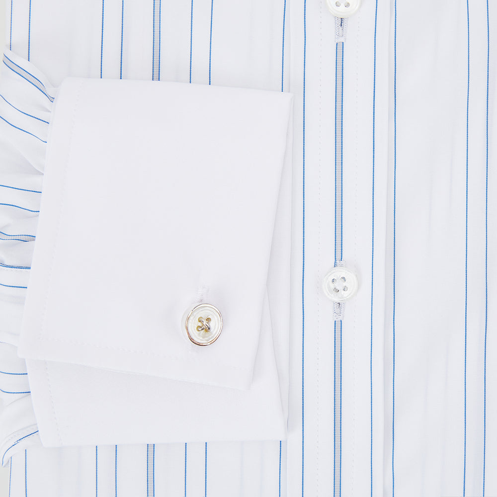 The Turnbull & Asser Pale Blue Multi Stripe Shirt features thin vertical stripes, a contrast collar, and double cuffs, displayed on a plain light background.