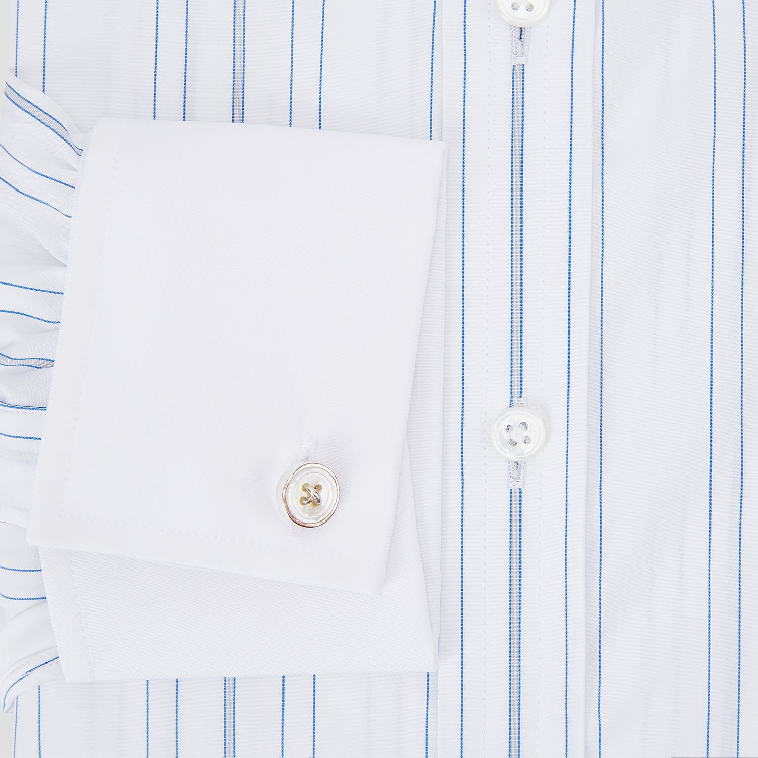View 4 of product The Turnbull & Asser Pale Blue Multi Stripe Shirt features thin vertical stripes, a contrast collar, and double cuffs, displayed on a plain light background.
