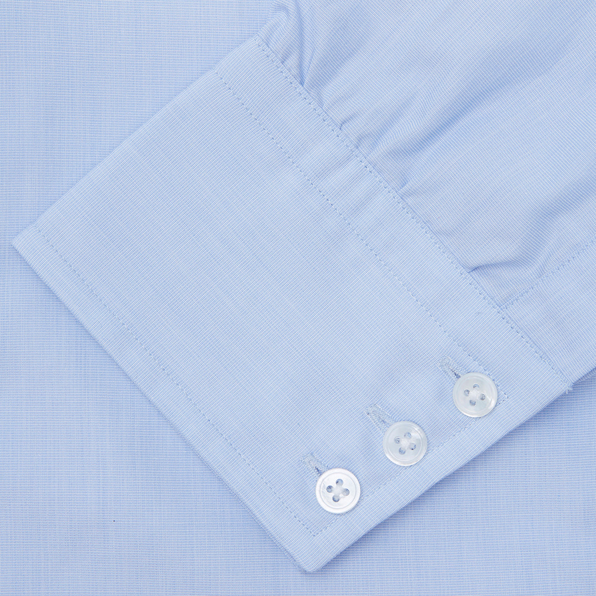 View 6 of product The Turnbull & Asser Light Blue End-on-End Shirt features a T&A collar and 3-button cuffs, neatly displayed against a plain white background—ideal for pairing with a navy suit.