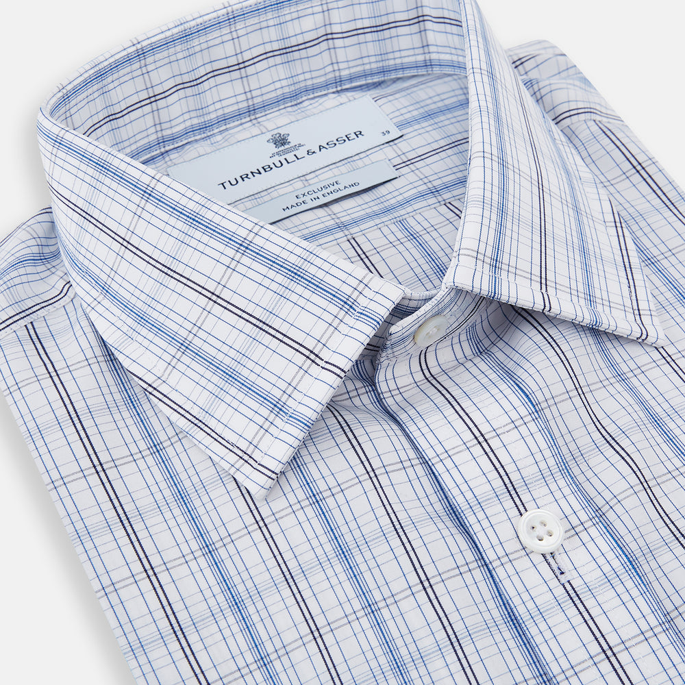 The Turnbull & Asser Blue and Navy Multi Check Mayfair Shirt features a classic T&A collar and long sleeves, with a blue multi-check pattern on white, neatly displayed against a plain white background.