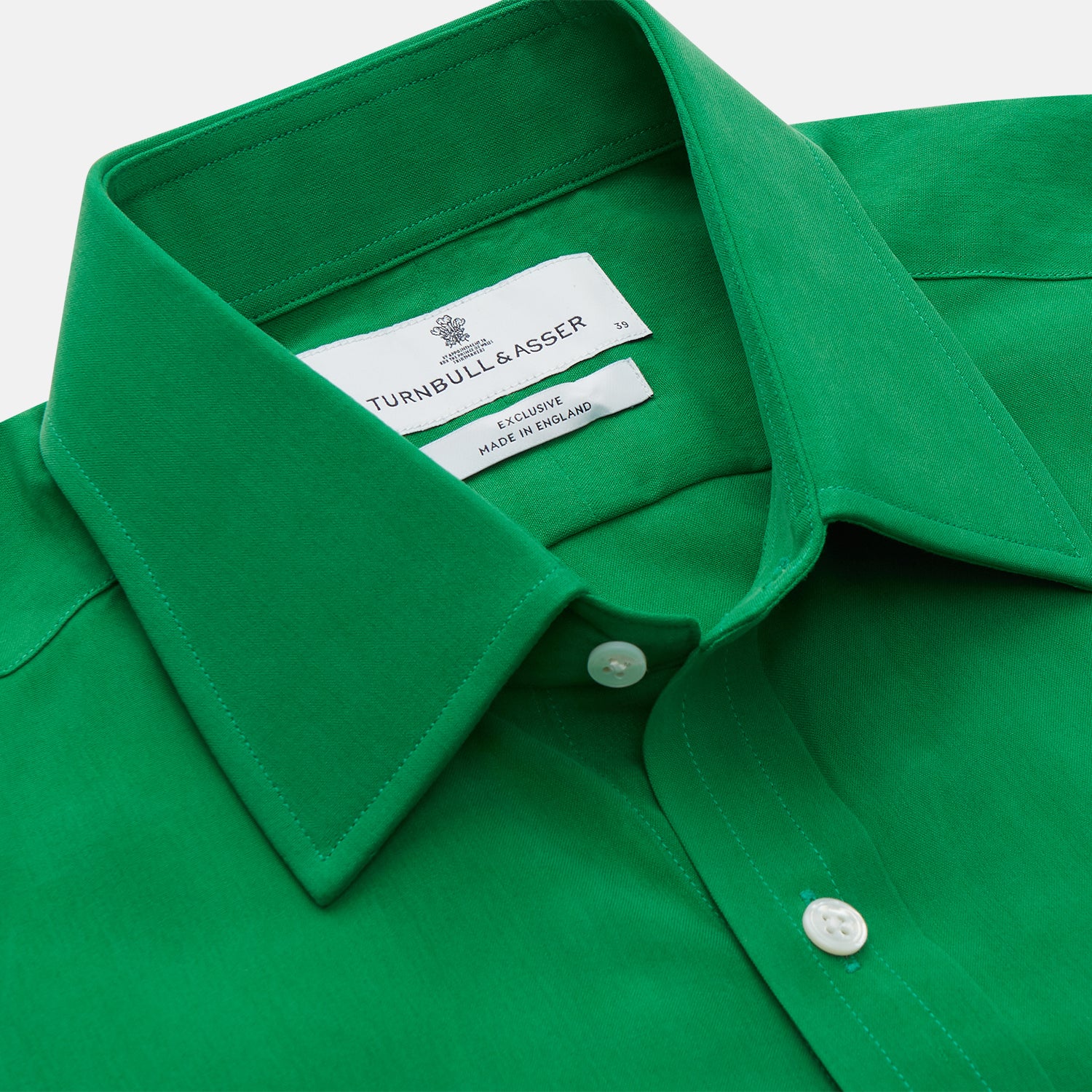 View 2 of product The Green Sandwashed Silk Regular Fit Mayfair Shirt by Turnbull & Asser, featuring long sleeves, a T&A collar, and white buttons, is displayed flat on a white background.