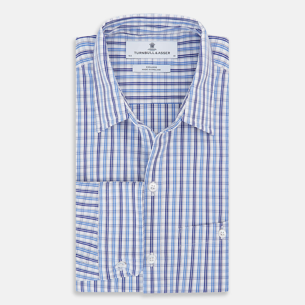 Turnbull & Asser's Blue and Navy Multi Check Piccadilly Shirt features long sleeves, a pointed collar, and two buttoned chest pockets, shown on a white background.