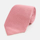 The Turnbull & Asser Pink and White Houndstooth Silk Tie features a small pattern and is displayed rolled up on a plain white background, making it perfect for pairing with any office shirt.
