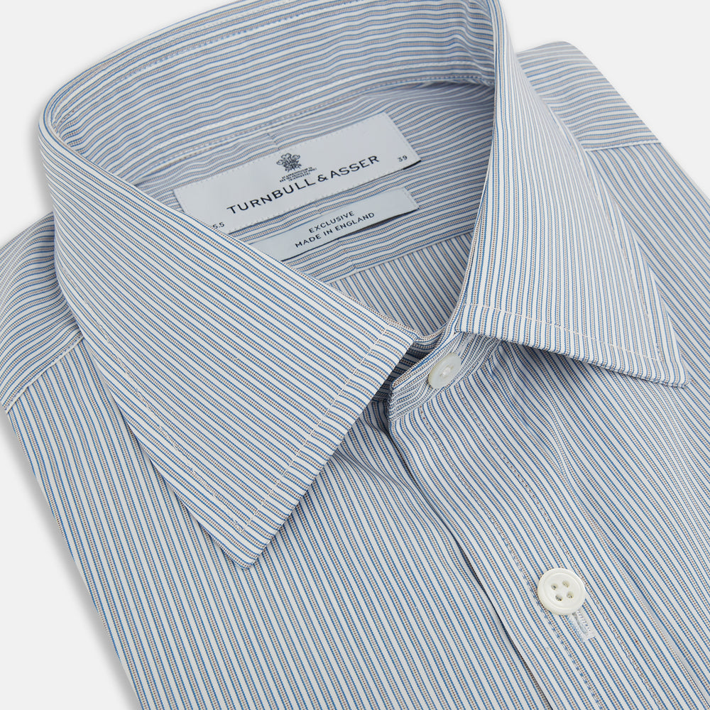 The Blue and Brown Ticking Stripe Mayfair Shirt by Turnbull & Asser, crafted from premium Italian cotton with a collar, white buttons, and buttoned cuffs, is an essential addition to any gentleman's wardrobe.