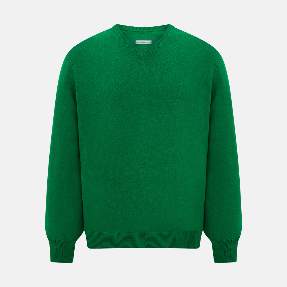 The Turnbull & Asser Grass Green Cashmere V-neck Jumper, with long sleeves, is displayed against a white background, highlighting its classic knitwear style.