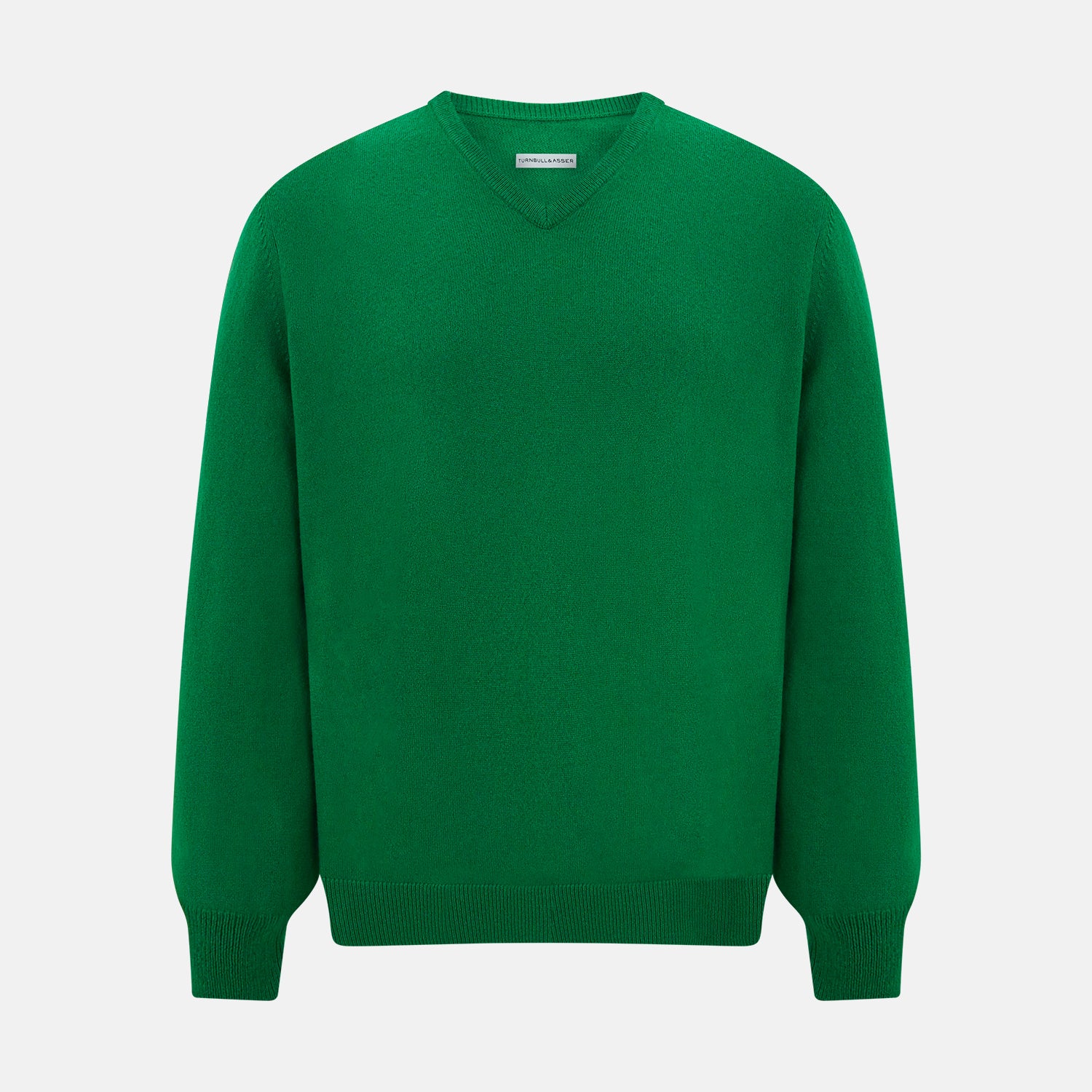View 1 of product The Turnbull & Asser Grass Green Cashmere V-neck Jumper, with long sleeves, is displayed against a white background, highlighting its classic knitwear style.