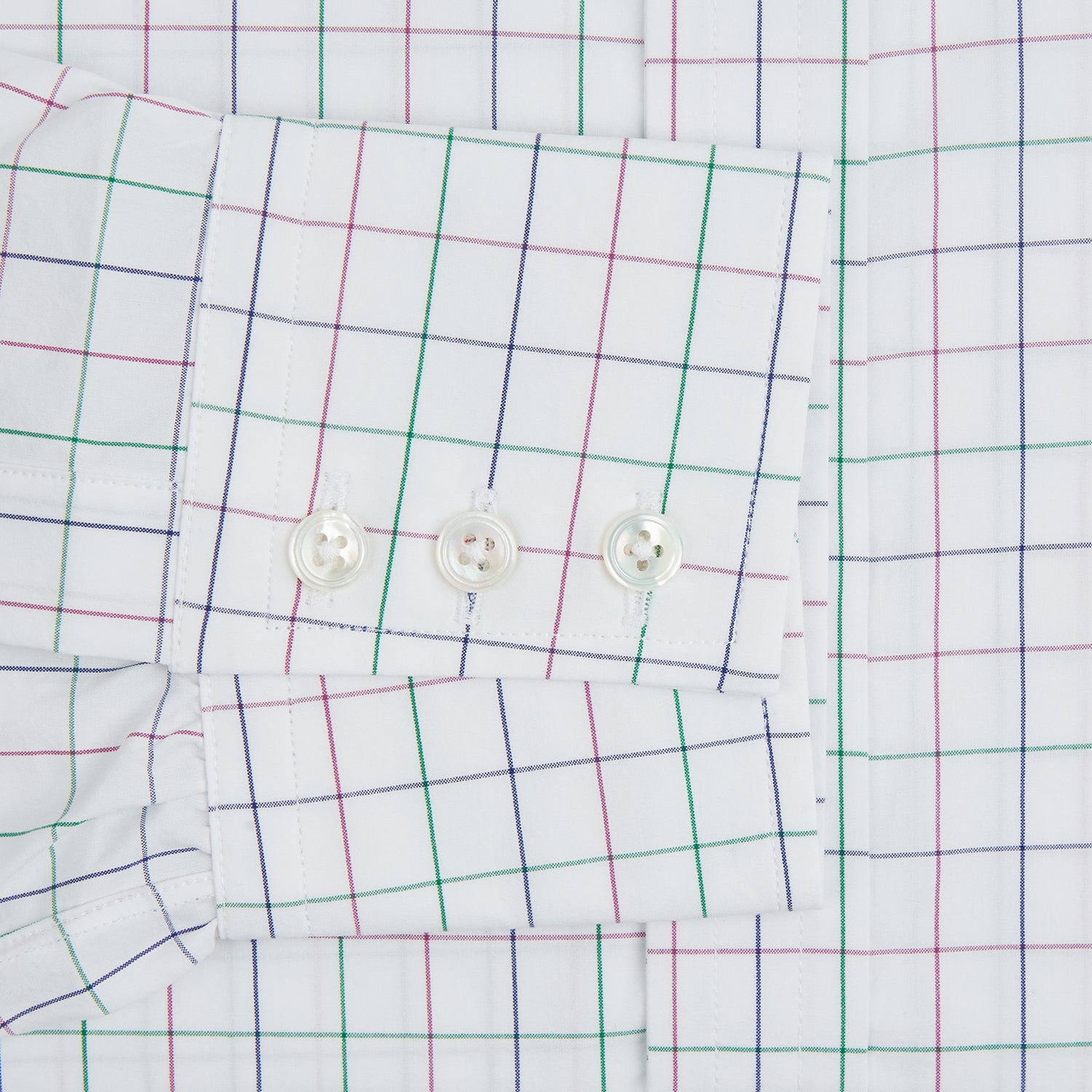 View 3 of product The Turnbull & Asser Pink Grid Check Mayfair Shirt is a long-sleeve, button-down shirt with a T&A collar, crafted from organic cotton and featuring a pink checkered grid pattern on white with buttoned cuffs.