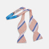 View 2 of product The Thistle-Petersham-Double End Bow Tie by Turnbull & Asser features a pink base with diagonal blue, white, and navy stripes—a versatile accessory perfect for any gentleman's wardrobe.