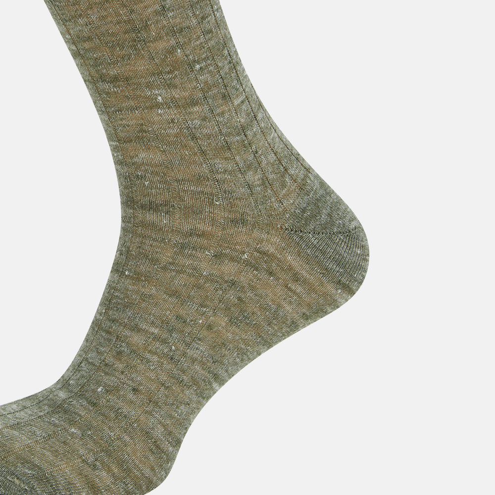 The Forest Green Linen Mid-Length Sock by Turnbull & Asser features a ribbed texture and is shown upright on a plain white background. Made from breathable linen, it offers comfort and style for everyday wear.