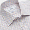 View 3 of product A man stands against a beige background, facing forward with a neutral expression and arms relaxed, wearing the Turnbull & Asser Red Multi Check Regular Fit Mayfair Shirt.