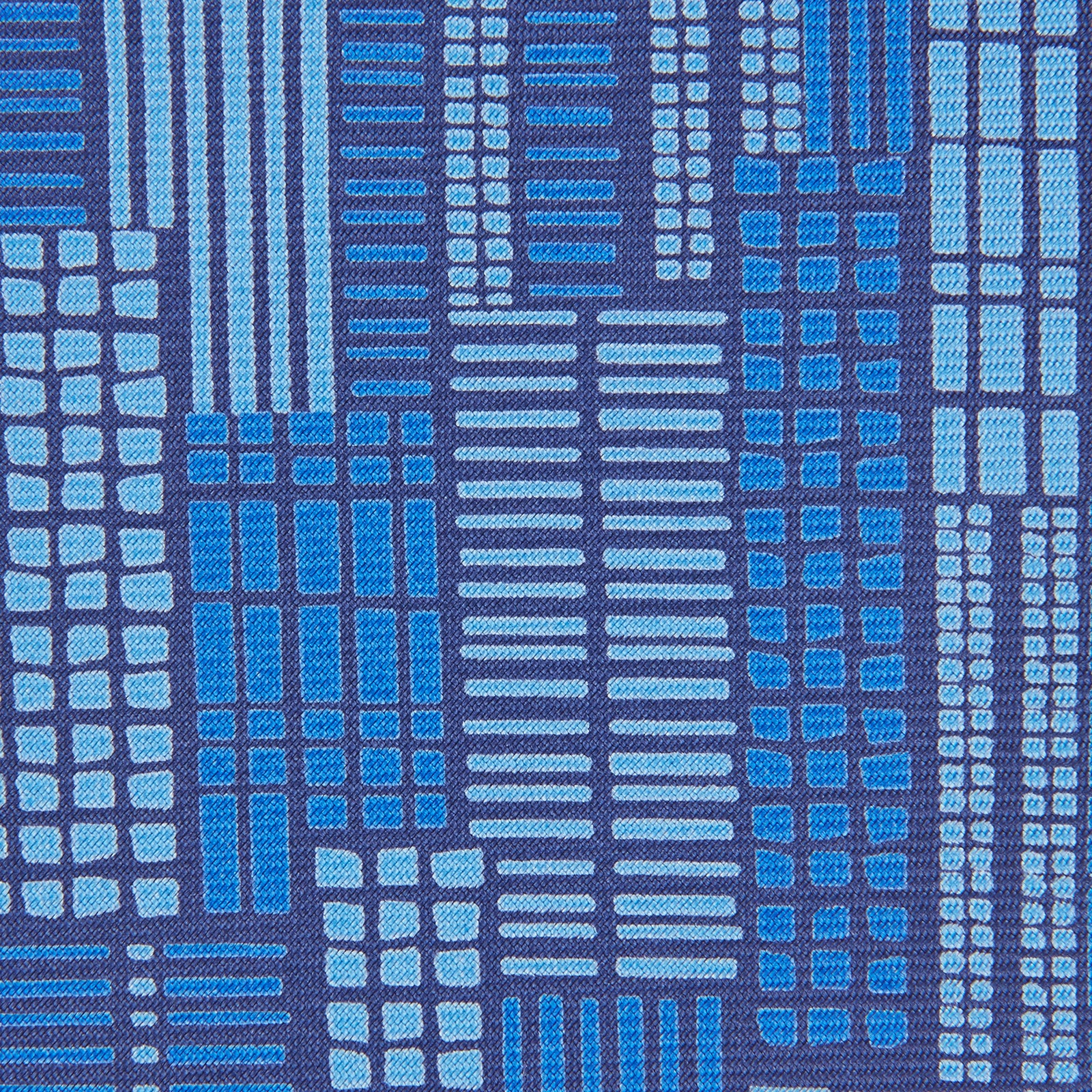 View 2 of product The Turnbull & Asser Blue Motif Printed Foulard Silk Tie showcases a geometric pattern in varying blue shades, making it a striking and essential accessory for any wardrobe.