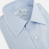 View 2 of product The Pale Blue Mayfair Shirt by Turnbull & Asser is a long-sleeve, button-up dress shirt with a pointed collar and buttoned cuffs, crafted from sanforised cotton and shown laid flat on a white background.