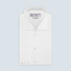 View 4 of product The Turnbull & Asser Two-Fold 120 White Shirt with a Regent collar and 3-button cuffs is neatly folded and displayed against a light blue background.