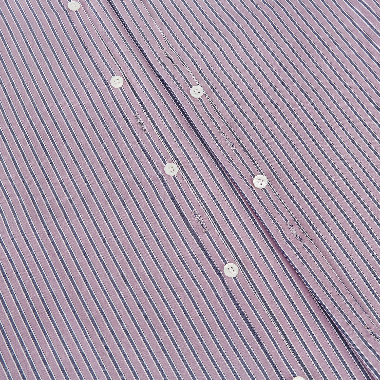 View 7 of product The Turnbull & Asser Antique Pink Ticking Stripe Westminster Shirt is a collared, long-sleeve button-up with thin vertical pink stripes on white, highlighting British craftsmanship. It’s shown neatly laid flat and fully buttoned.