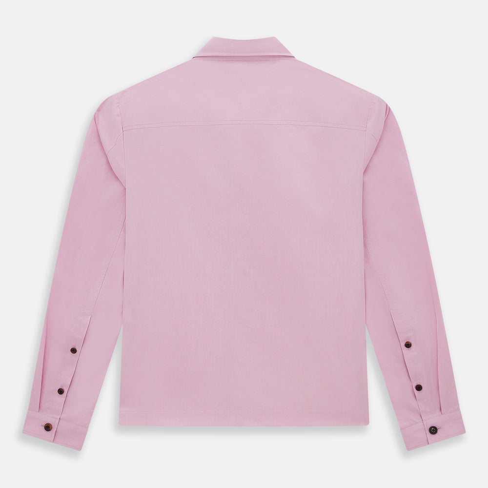 The Pink Hyde Overshirt by Turnbull & Asser is a long-sleeved, light pink sanforised cotton shirt with a left chest pocket and dark buttons—an elegant, laid-back alternative to a blazer.