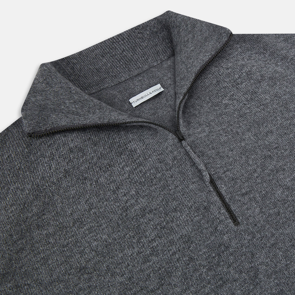 The Turnbull & Asser Slate Grey Melange Half-Zip Cashmere Jumper features a high collar and long sleeves, crafted from premium knitwear, and is shown against a plain white background.