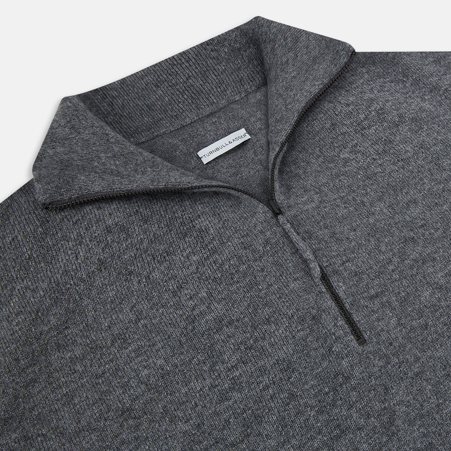 View 2 of product The Turnbull & Asser Slate Grey Melange Half-Zip Cashmere Jumper features a high collar and long sleeves, crafted from premium knitwear, and is shown against a plain white background.