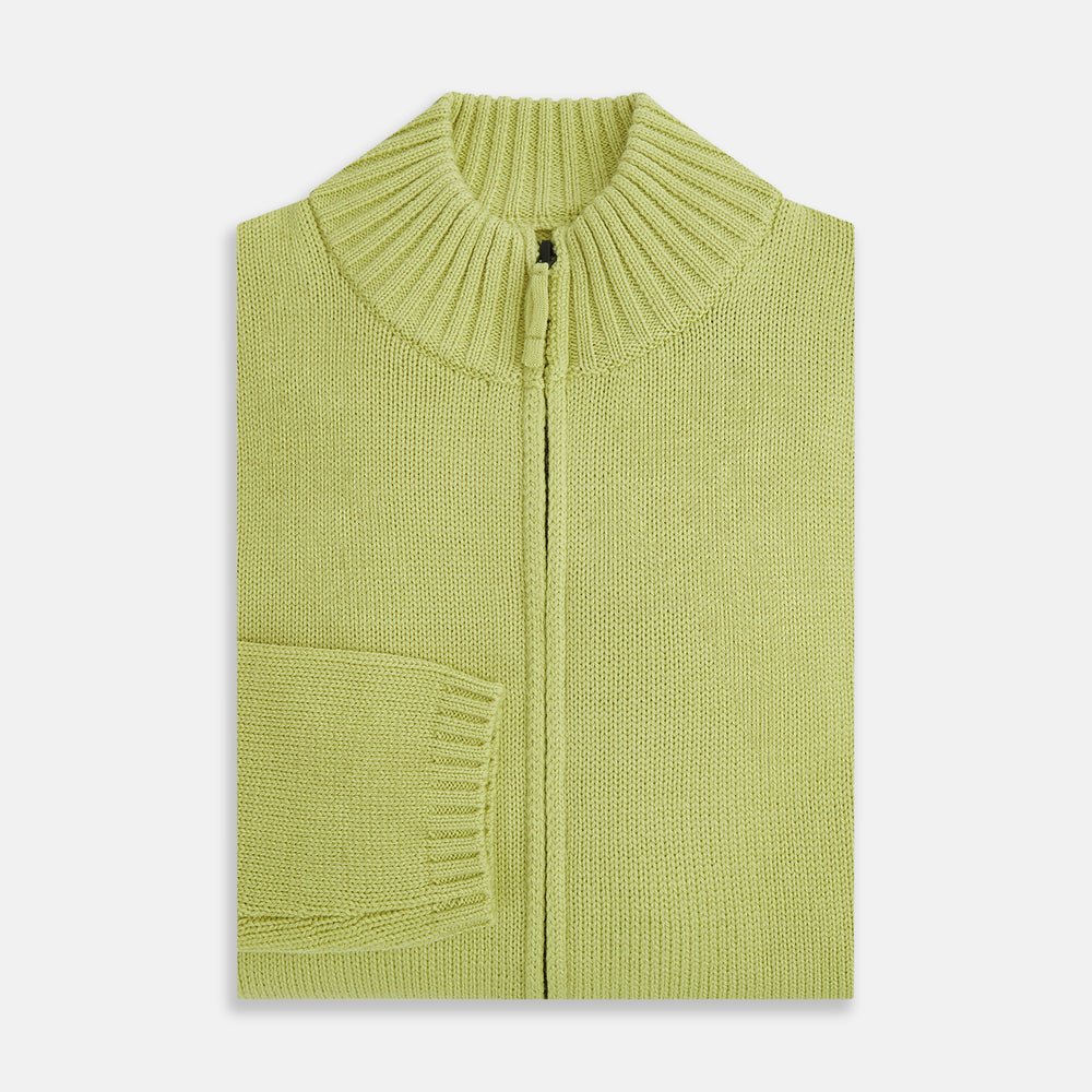 The Melon Green Merino High Neck Zipped Cardigan by Turnbull & Asser features long sleeves and ribbed collar, cuffs, and hem, shown on a plain white background.