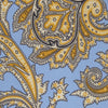 View 3 of product The Turnbull & Asser GGT92000 3062 06 OS is a rolled-up necktie with an intricate blue and yellow paisley pattern on a light blue background—a stylish accessory for any wardrobe.