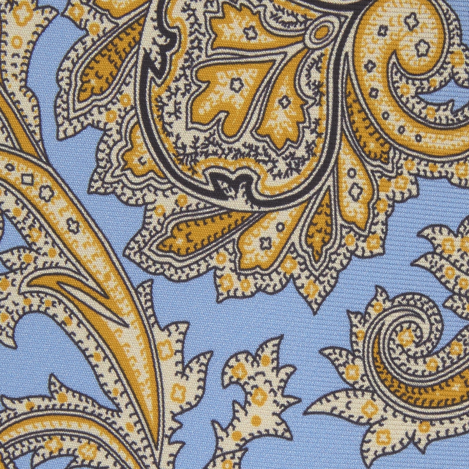 View 3 of product The Turnbull & Asser GGT92000 3062 06 OS is a rolled-up necktie with an intricate blue and yellow paisley pattern on a light blue background—a stylish accessory for any wardrobe.