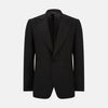 View 3 of product The Turnbull & Asser Black Single Breasted Dinner Suit, with satin lapels and matching trousers, is elegantly folded and displayed on a plain white background.