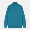 View 1 of product The Teal Lennox Half-Zip Jumper by Turnbull & Asser features a quarter-zip front, long sleeves, high collar, and ribbed cuffs and hem, shown laid flat on a light background.