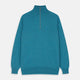 The Teal Lennox Half-Zip Jumper by Turnbull & Asser features a quarter-zip front, long sleeves, high collar, and ribbed cuffs and hem, shown laid flat on a light background.
