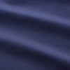 View 5 of product The Blue Piece Dyed Weekend Fit Suffolk Shirt by Turnbull & Asser features a button-down Dorset collar, chest pocket, white buttons, and long sleeves in classic navy, laid flat against a white background.