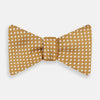 View 1 of product The Turnbull & Asser Camel and White Diamond Silk Bow Tie features a ribbed texture with evenly spaced white diamond shapes, offering an elegant accessory for formalwear, shown on a white background.