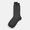 View 2 of product Turnbull & Asser Grey Motif Mid-Length Sock, crafted from Egyptian cotton, features a fine white geometric dot pattern on grey with a solid black cuff, heel, and toe for classic style. Displayed on a white background.
