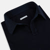 View 2 of product A Navy Rugby Polo Shirt by Turnbull & Asser, featuring long sleeves and a collar, is displayed flat on a white background. The design is simple and free of visible logos or patterns.