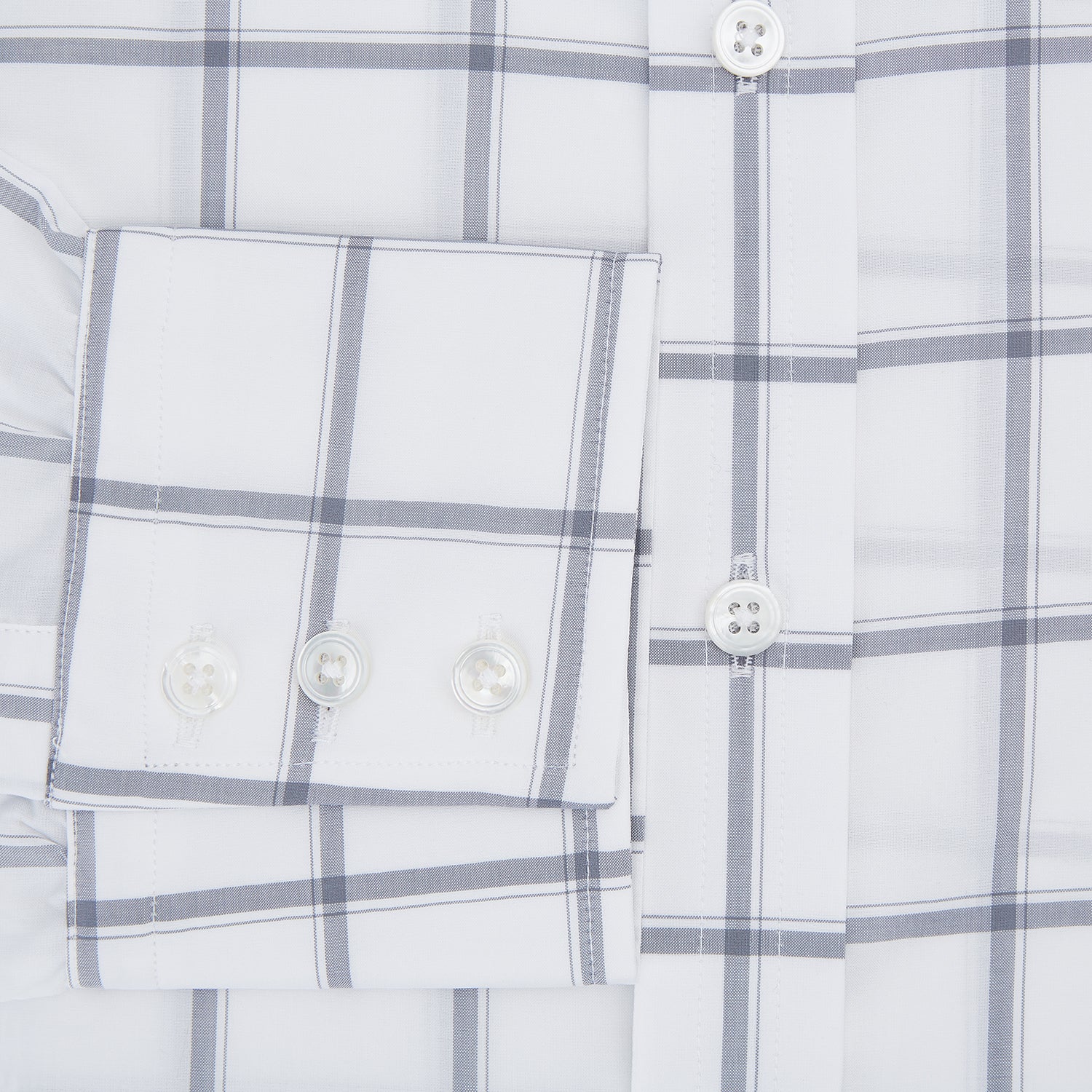 View 4 of product The Turnbull & Asser Grey Grid Check Mayfair Shirt features a classic collar and buttoned cuffs, crafted from fine Italian cotton with a grey grid check on white, and is shown against a plain white background.