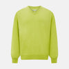 View 1 of product The Lemon Green Cashmere V-neck Jumper by Turnbull & Asser features ribbed cuffs and hem—an essential long sleeve knitwear piece, shown against a white background.