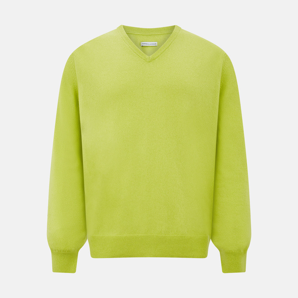 The Lemon Green Cashmere V-neck Jumper by Turnbull & Asser features ribbed cuffs and hem—an essential long sleeve knitwear piece, shown against a white background.