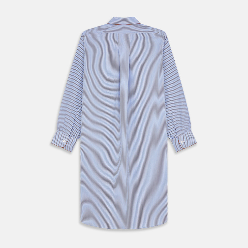 The Blue and Navy Halo Stripe Cotton Sussex Nightshirt by Turnbull & Asser features long sleeves, a collar, button-down front, chest pocket, curved hem, and brown piping for a classic luxury sleepwear style.