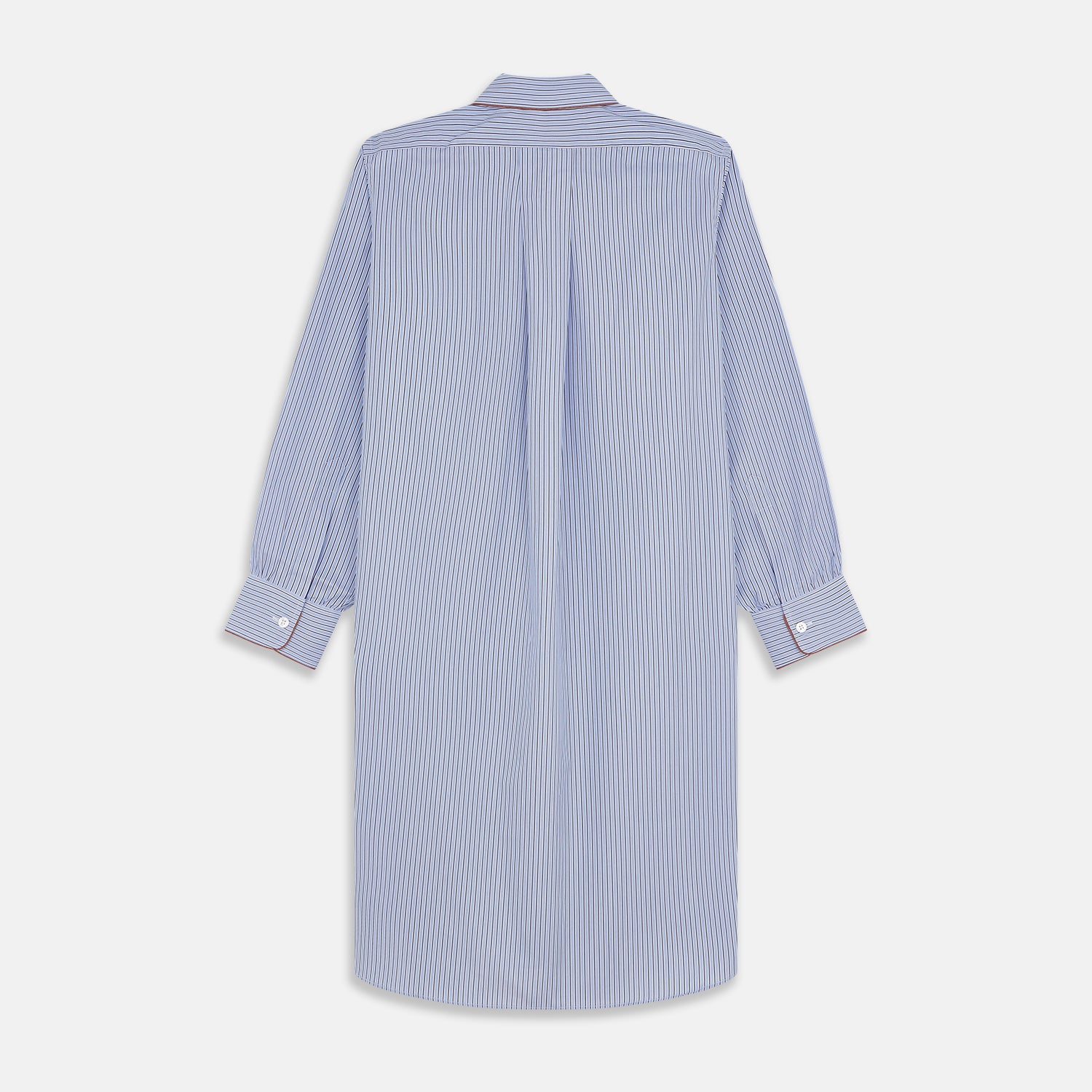 View 5 of product The Blue and Navy Halo Stripe Cotton Sussex Nightshirt by Turnbull & Asser features long sleeves, a collar, button-down front, chest pocket, curved hem, and brown piping for a classic luxury sleepwear style.