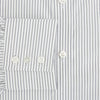 View 4 of product The Navy Music Stripe Mayfair Shirt by Turnbull & Asser features thin vertical blue and white stripes, a classic T&A collar, and long sleeves, shown on a plain white background.
