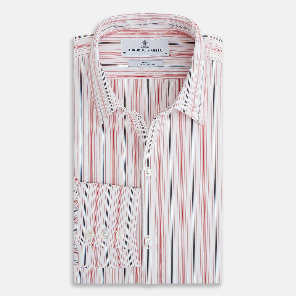 The Red Multi Pencil Stripe Windsor Shirt by Turnbull & Asser features long sleeves, buttoned cuffs, a Turnbull collar, and classic British tailoring with vertical red, pink, and white stripes.