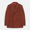 View 1 of product The Turnbull & Asser Rust Linen-Wool-Silk Bertie Blazer is a red double-breasted jacket with peak lapels, black buttons, and flap pockets, tailored in Italy from a luxury linen-wool-silk blend and shown on a white background.