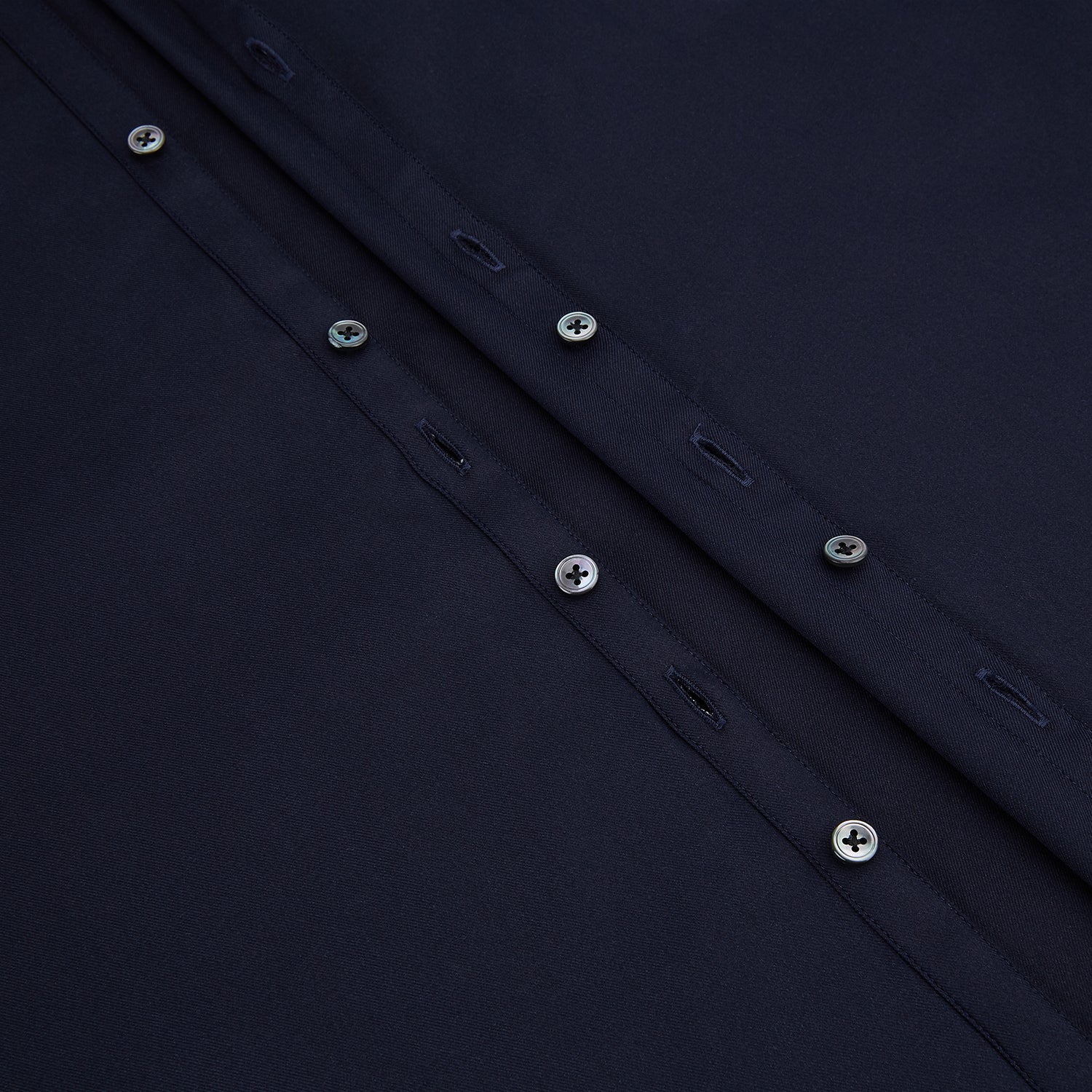 View 7 of product The Navy Twill Windsor Shirt by Turnbull & Asser features long sleeves, a button-up front, British craftsmanship, and a refined Windsor collar, shown in dark navy on a plain white background.