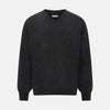 View 1 of product The Turnbull & Asser Charcoal Grey Melange V-Neck Cashmere Jumper is shown on a white background, featuring long sleeves, ribbed cuffs and hem for classic style and comfort.